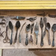 Spoons, knives, scissors, and other objects found inside the chimney.
